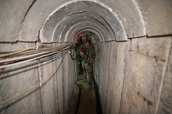 An Israeli soldier walks in a tunnel near the European Hospital.