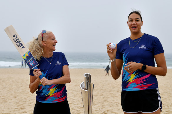 Kerri Pottharst and Liz Cambage try their hand at a bit of cricket. 