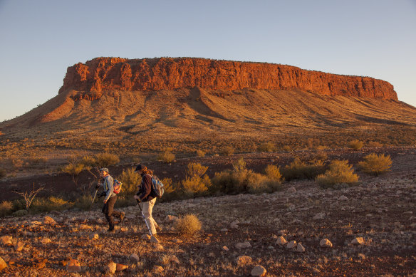 Visitors near Mount Conner on Curtin Springs Station.