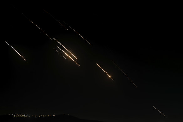 Missiles launched from Iran towards Israel are seen in the West Bank city of Nablus on Tuesday.