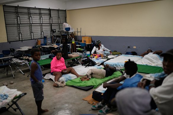 People in Jamaica shelter before the hurricane’s arrival.
