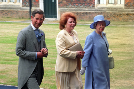The Prince of Wales and the Queen with Lady Elizabeth Anson (centre) at a wedding reception in  1995. 