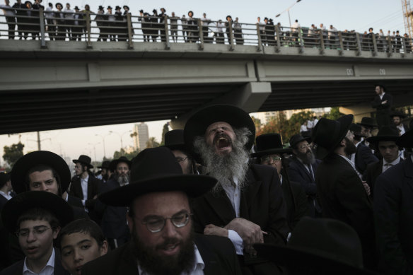 Ultra-Orthodox Jewish men block a highway during a protest against army recruitment in Bnei Brak, Israel.