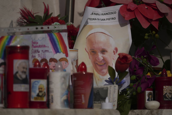An image of Pope Francis among candles in front of the Agostino Gemelli Polyclinic, in Rome, on Sunday.