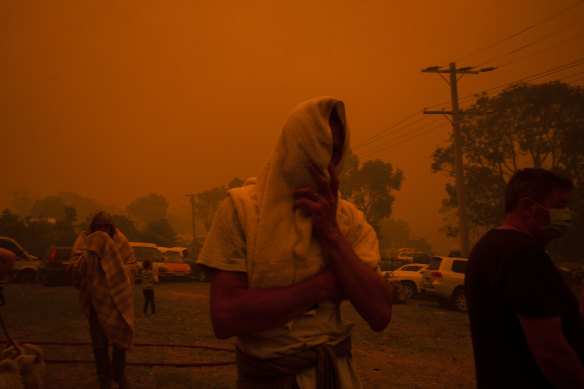 New Year’s Eve 2019: People seek shelter under heavy smoke at the Mallacoota Gymnasium relief centre.