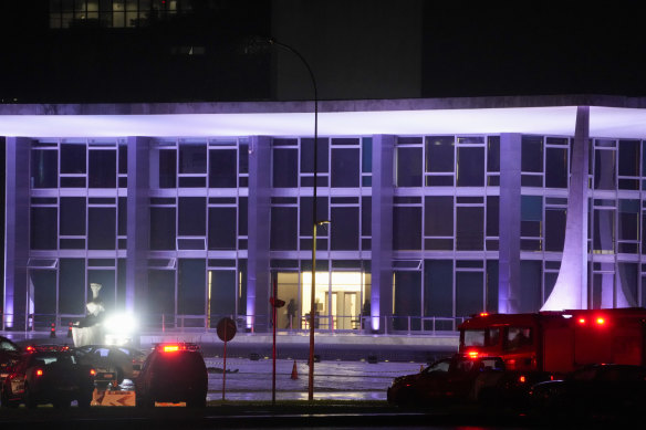 Police vehicles are parked outside the Supreme Court in Brasília, Brazil, following an explosion.