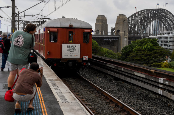 A “Red Rattler” departs Milsons Point to cross the Harbour Bridge. One of the carriages was on the first trip across the bridge 90 years ago.