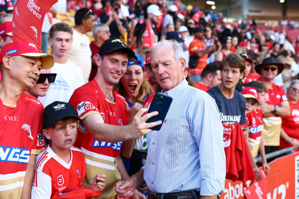 Bennett poses for a selfie with a Dolphins fan after the win over the Roosters.