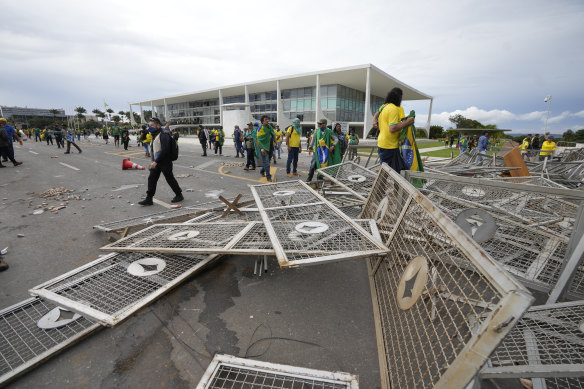Protesters, supporters of Brazil’s former president Jair Bolsonaro, broke through police barricades to storm the Planalto Palace in Brasilia.