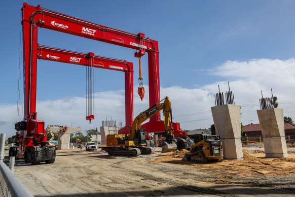 Four large gantry cranes have been deployed to help build the elevated rail. 