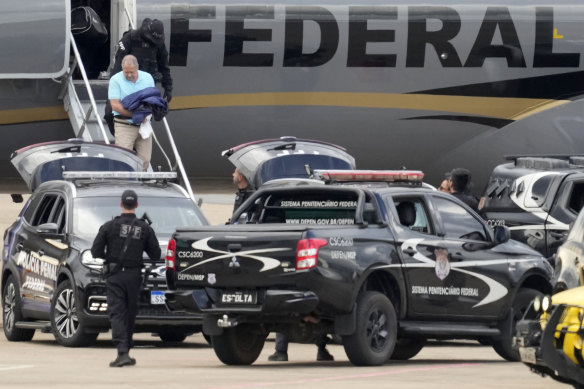 Federal MP Chiquinho Brazao, a suspect implicated in the killing of  Marielle Franco, disembarks from a police plane at the airport in Brasilia.