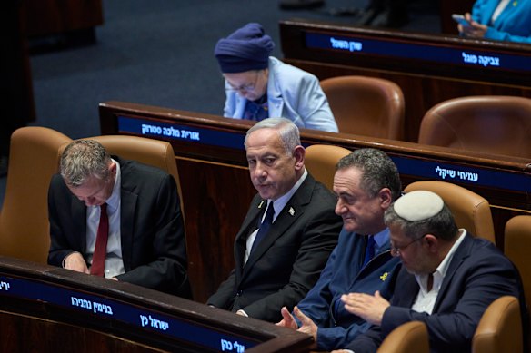 Israel’s Prime Minister Benjamin Netanyahu, surrounded by ministers from the government attends a session of the Knesset – Israel’s parliament – in Jerusalem, on Monday.