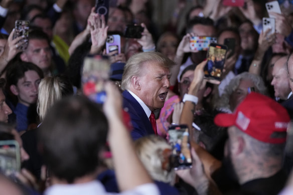 Former President Trump arrives at his Mar-a-Lago estate after being arraigned in New York. 