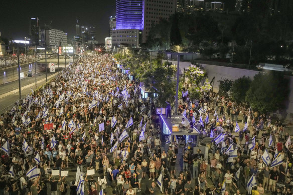 People protest against Israeli Prime Minister Benjamin Netanyahu’s government and call for the release of hostages on Saturday night.