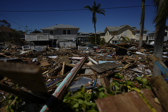 A road is filled with debris from destroyed beachfront homes and businesses, two days after the passage of Hurricane Ian, in Fort Myers Beach, Florida on Friday.