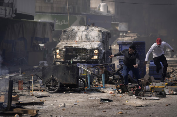 Palestinians clash with Israeli forces in the West Bank city of Nablus.