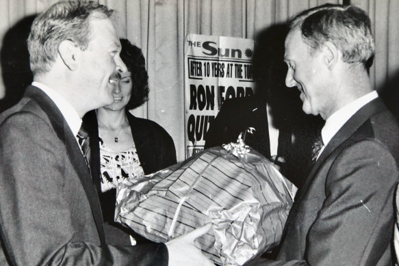 Sun chief sub-editor Kerry Myers presents Ron Ford with a farewell gift on his retirement in 1987.