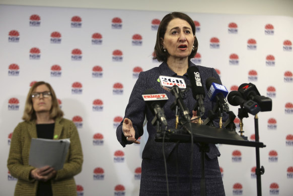 Then-NSW premier Gladys Berejiklian gives a COVCID update in 2020. Data analysts had to track press conferences to learn the latest COVID numbers.