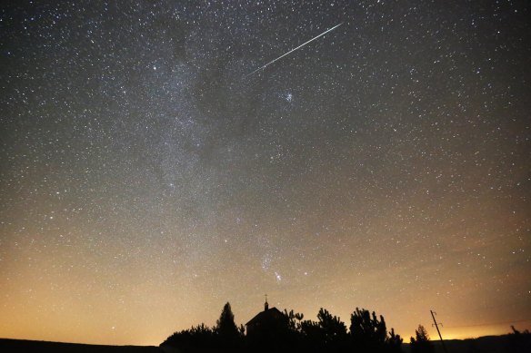 A meteor of the Geminids meteor shower burns up in the atmosphere behind an Orthodox church near the village of Zagorie, some 110 km from Minsk, Belarus, in December 2017. The Geminids meteor shower occurs every year in December and is caused by the object 3200 Phaethon. 