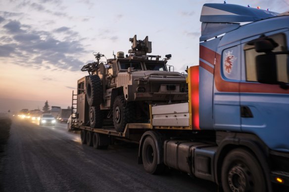 A convoy of US armoured military vehicles leave Syria on a road to Iraq on Saturday in Sheikhan, Iraq. 