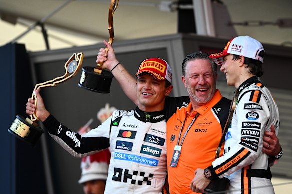 Race winner Lando Norris with McLaren CEO Zak Brown and third-place finisher Oscar Piastri.
