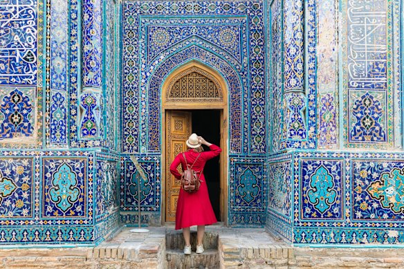 The intricate entrance of a tomb within the Shah-i-Zinda necropolis in Samarkand, Uzbekistan.