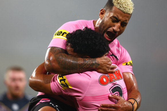 Viliame Kikau and Izack Tago celebrate a try on Saturday night.