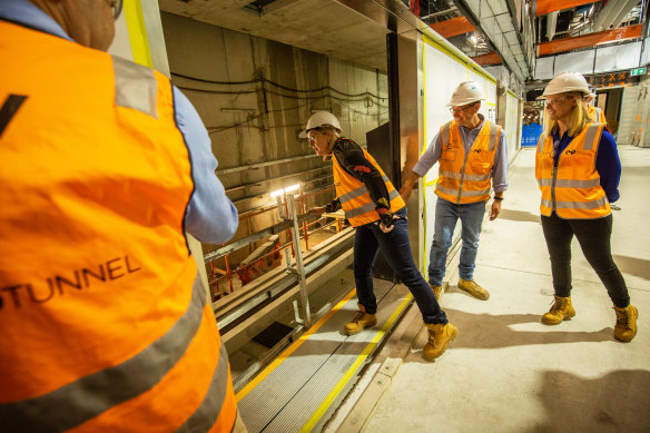 Allan inspects the work at Parkville Station.