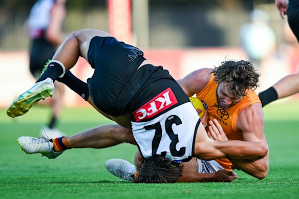Riley Thilthorpe gets physical with Power opponent Harrison Ramm, who injured his shoulder in their clash.