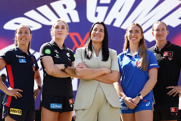 Laura Kane (centre) is working on an AFLW Gather Round-type event for next year in Sydney. 