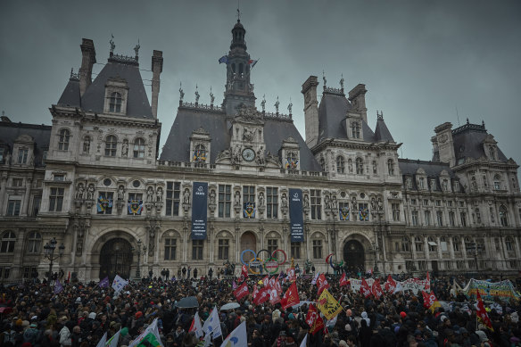Demonstrators gather outside Hotel de Ville against the decision by the French Constitutional Council to approve Emmanuel Macron’s pension reform.