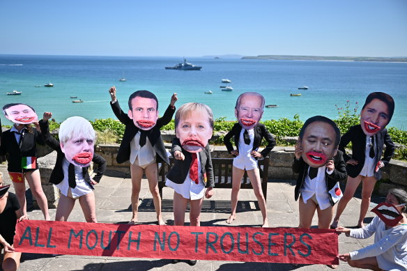 Extinction Rebellion protesters mock the G7 leaders in Cornwall.
