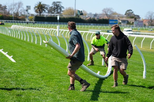 Caulfield track staff moved the running rail before Saturday’s meeting started.