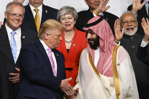 Donald Trump shakes the hand of the Crown Prince of Saudi Arabia Mohammad bin Salman at the G20 summit in Japan.