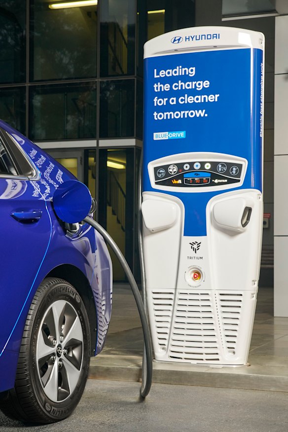 A Hyundai Ioniq at a charging station. Infrastructure Australia has identified a nationwide fast-charging network as a high priority.