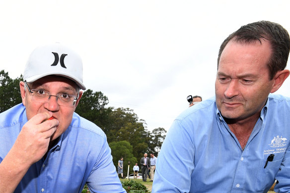 Prime Minister Scott Morrison (left), flanked by the Liberal Member for Fisher Andrew Wallace. 