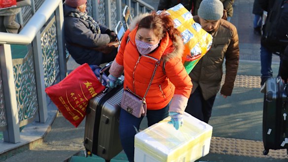 Struggling under the weight.