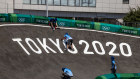 Staff work on the BMX track at Ariake Urban Sports Park on July 22, 2021 in Tokyo.
