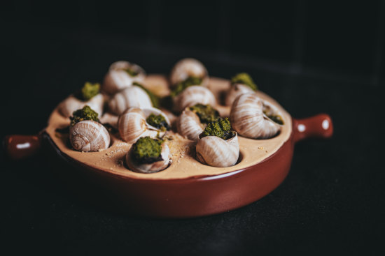 The French menu includes escargot.