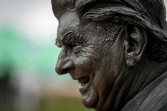 Bart Cummins statue smiles over the crowds for Derby Day.