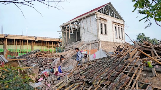Earthquake survivors collect usable items from the ruins of their house in Cianjur, West Java, Indonesia. The earthquake has toppled buildings on Indonesia’s densely populated main island, killing a number of people and injuring hundreds.