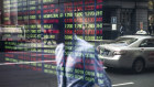 The ASX board on Bridge Street in Sydney. The exchange is replacing four key systems, including CHESS.