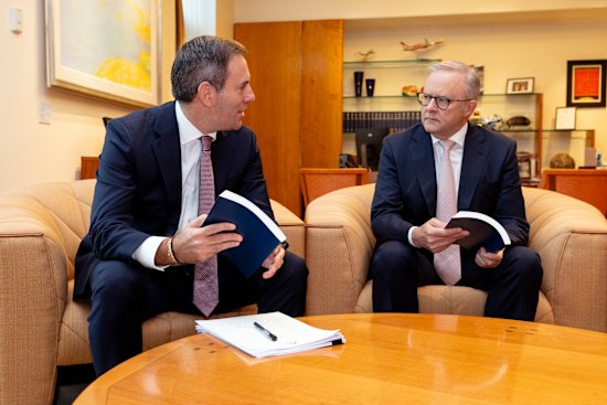 Treasurer Jim Chalmers and Prime Minister Anthony Albanese looking over the budget documents this morning.