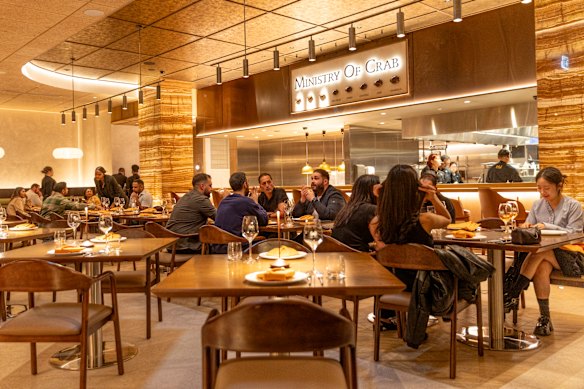 An open kitchen shares the theatre of crab cookery with diners.