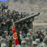 North Korean leader Kim Jong Un, centre, meets soldiers who took part in a training in North Korea