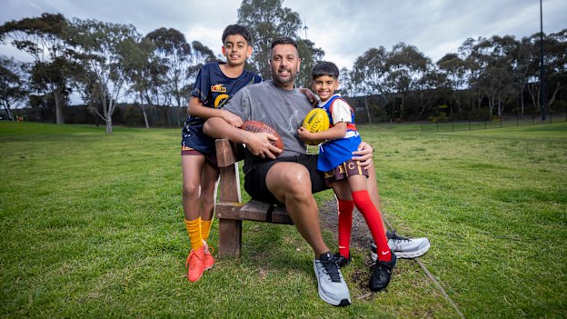 Balraj Singh, who was drafted to Adelaide 25 years ago, with six-year-old Memphis and 11-year-old Brooklyn.