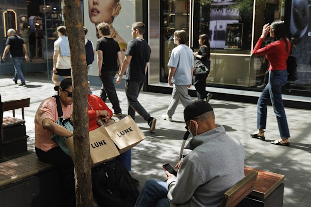 Shoppers sit down for a rest in Pitt St Mall in the Sydney CBD.