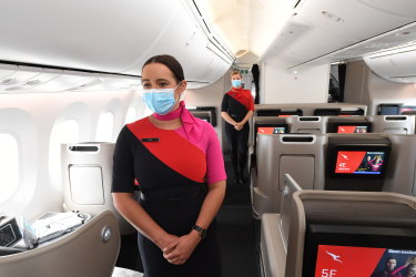Qantas cabin crew members get ready to fly.