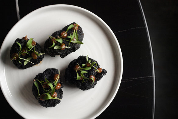 The fried chicken with ume and micro herbs at Kuro Bar &amp; Dining. 