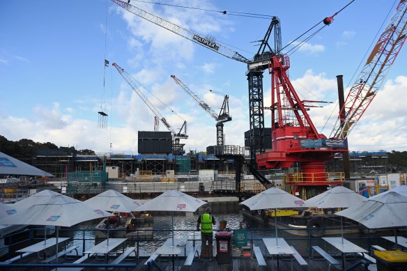 A construction worker looks towards the new Sydney Fish Market.